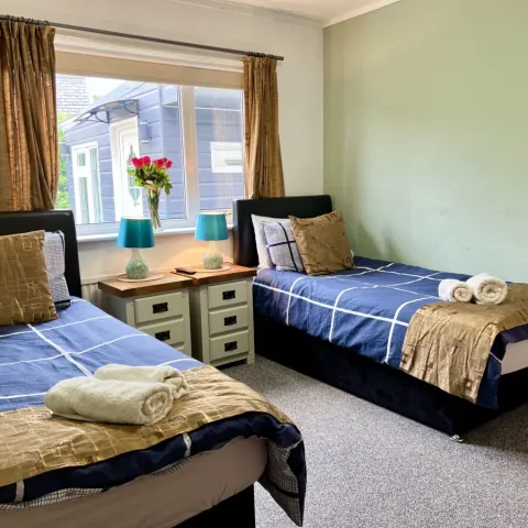 Room 2, two single beds beneath the window