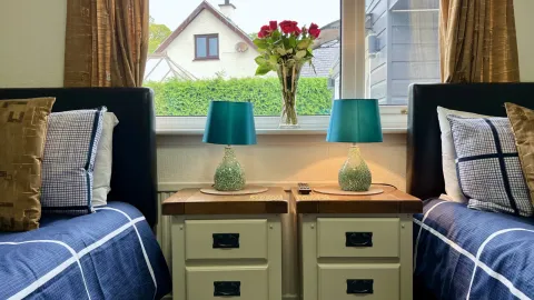 Room 2, bedside lamps by the window