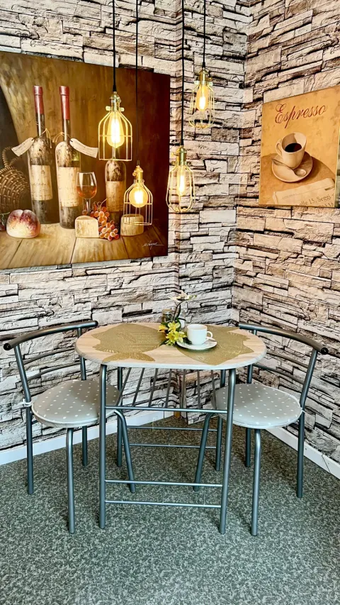 The breakfast table by the stone wall