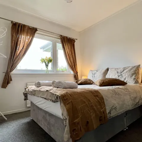Room 4, a double bed with the window beyond