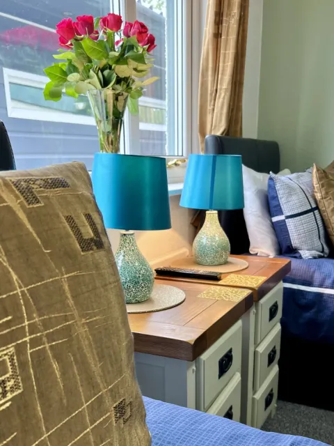 Room 2, flowers on the bedside table